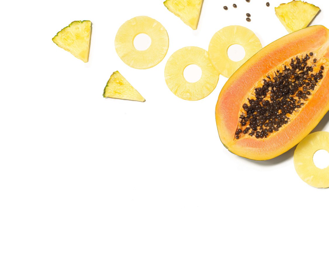 Sliced pineapple and papaya
