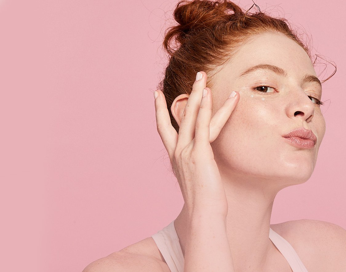 Women tapping her face with finger