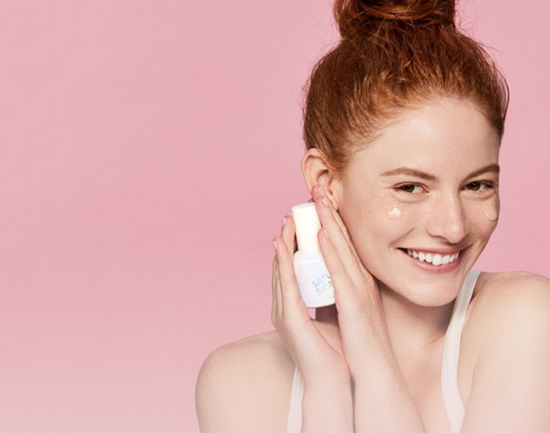 Women holding Saturday Skin Serum Product
