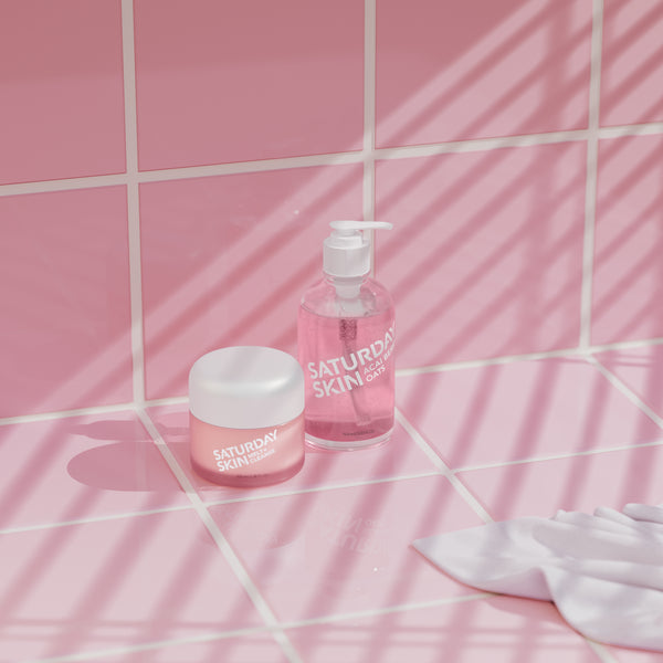 Lifestyle image of Melt + Cleanse Balm Jar and Acai Berry Gel Cleanser on pink tiles