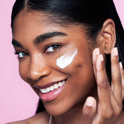 women put a product content on her face