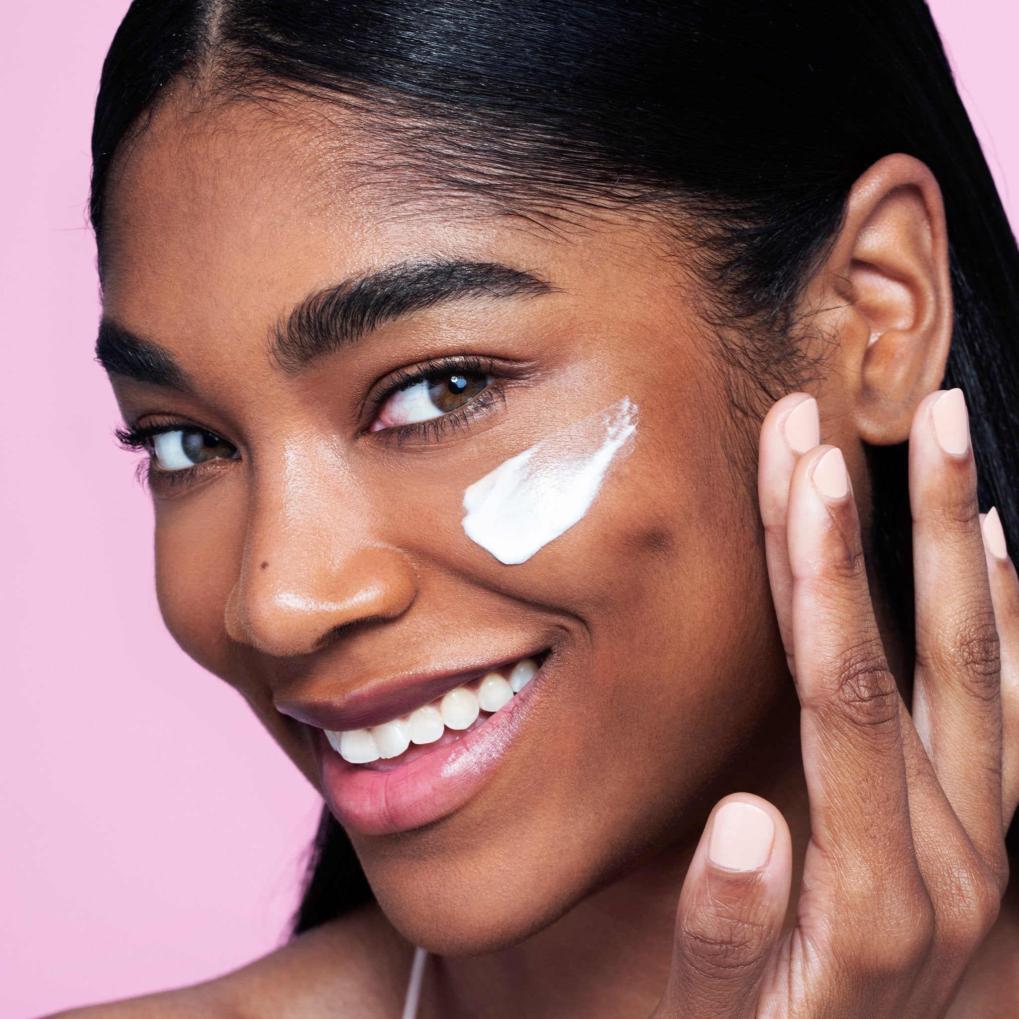 women put a product content on her face